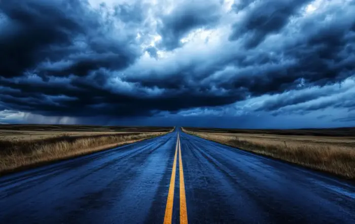 An empty road under a stormy sky, symbolizing the uncertain journey of getting off Delta 8.