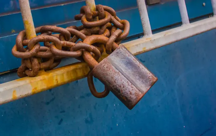 Rusty chain with a padlock, symbolizing the struggle of overcoming fentanyl addiction and seeking treatment.